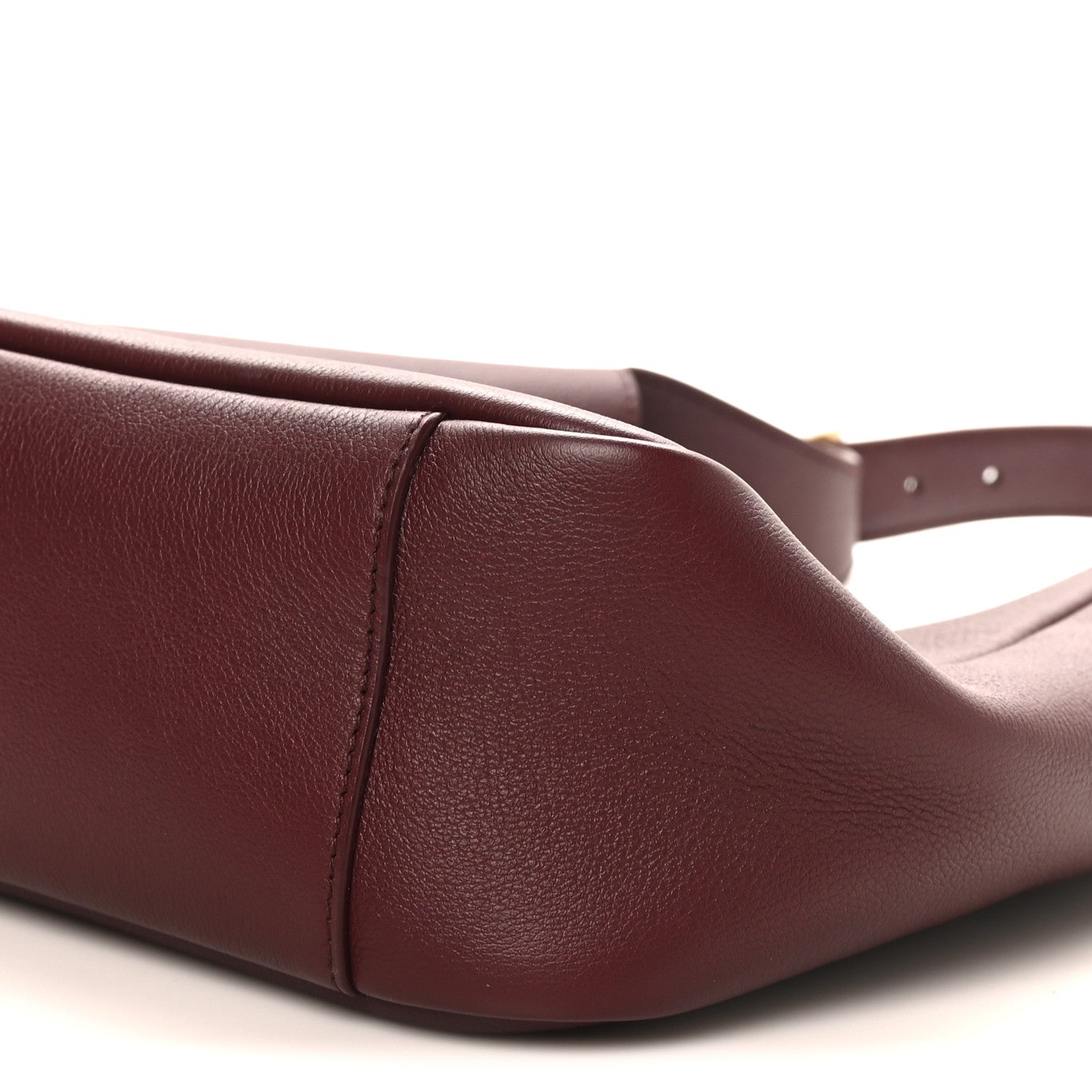 Burgundy leather hobo bag corner seam detail and top edge