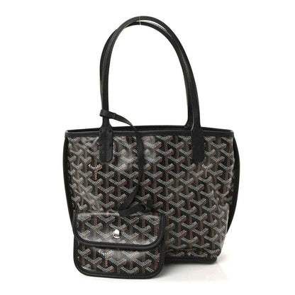 Reversible mini tote bag front view with black top handle and front pocket with snap closure
