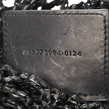 Black leather interior panel with embossed serial text on shoulder bag