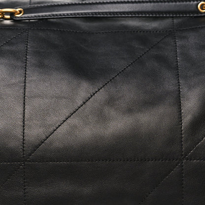 Black lambskin quilted matelasse panel with diagonal stitching and zipper trim