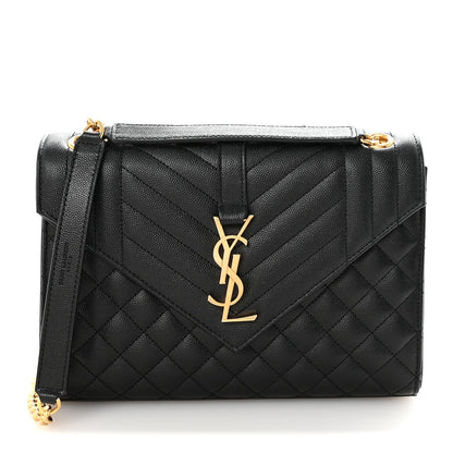 Black quilted medium satchel with front flap and gold YSL monogram, chain shoulder strap