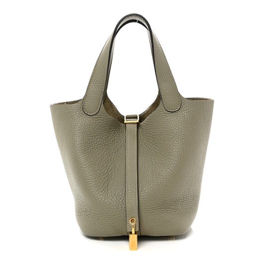 Sauge leather tote bag with top handles and gold lock tab at center front