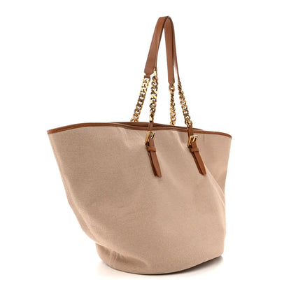 Desert dust canvas tote with brown leather straps and gold chain, side angle
