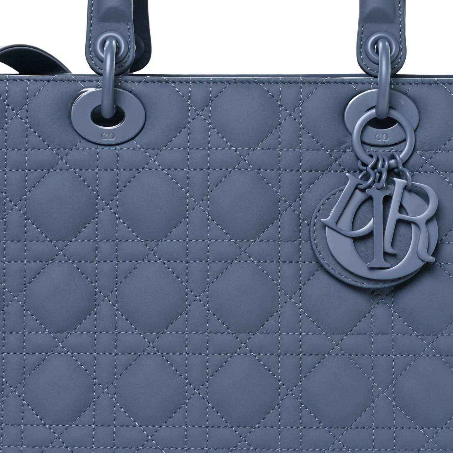 Denim blue quilted Lady Dior bag front with CD charm and top rings