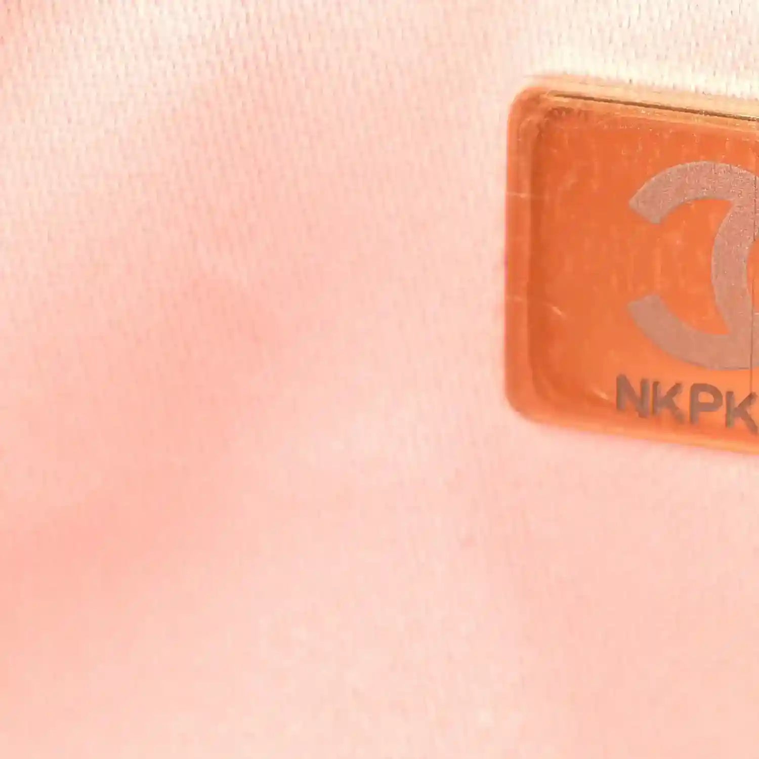 Pink leather handbag patch with brand-style emblem and NKPK marking
