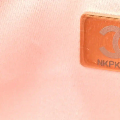 Pink leather handbag patch with brand-style emblem and NKPK marking