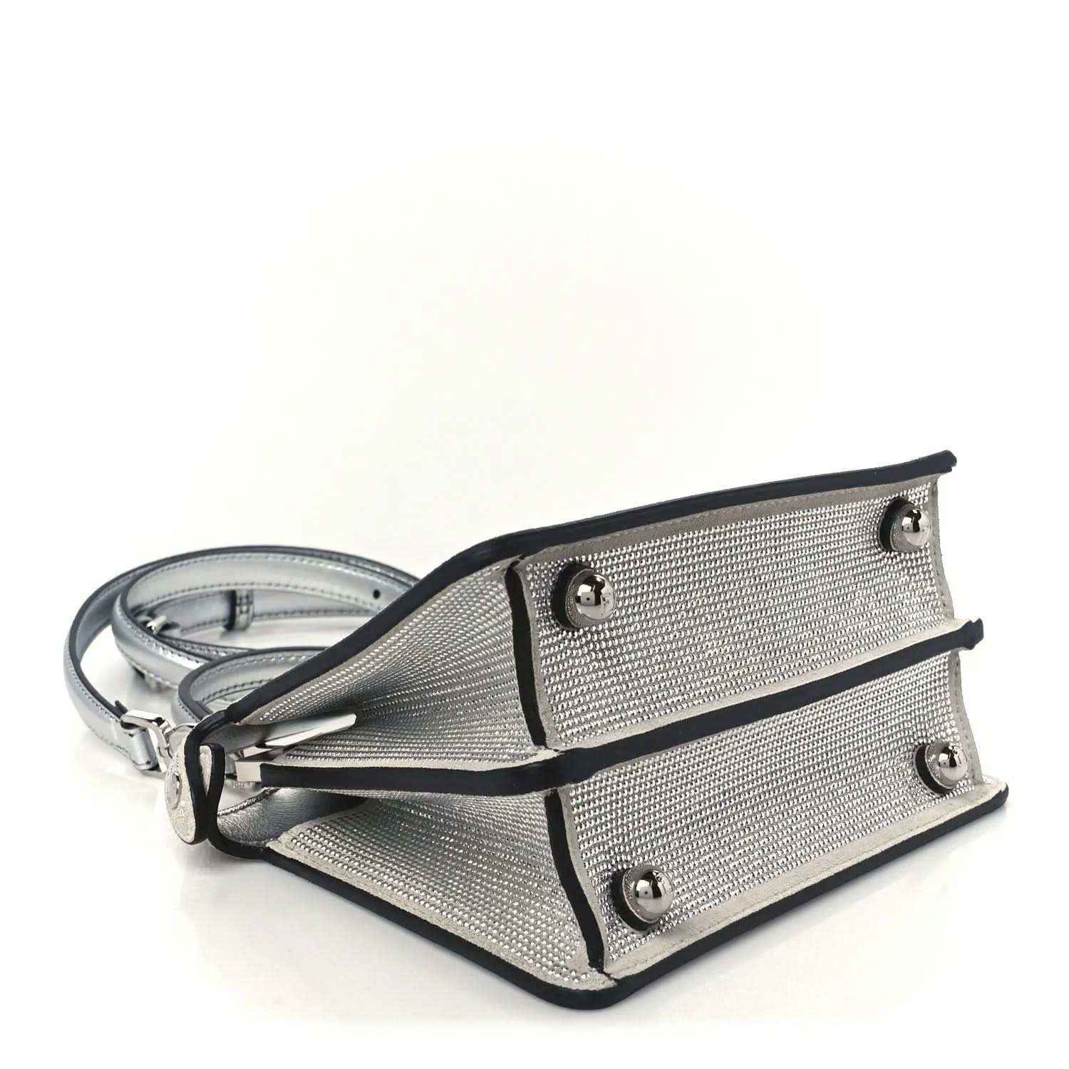 Crystal satchel with side straps and metal studs, with shoulder strap and hardware