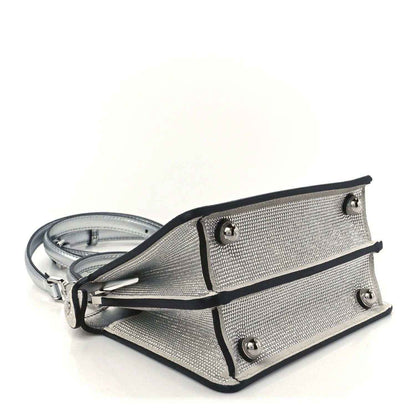 Crystal satchel with side straps and metal studs, with shoulder strap and hardware