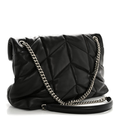 Black quilted puffer satchel with chain shoulder strap and flap front, side view