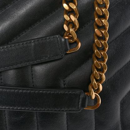 Black leather satchel with gold-tone chain strap and front tab