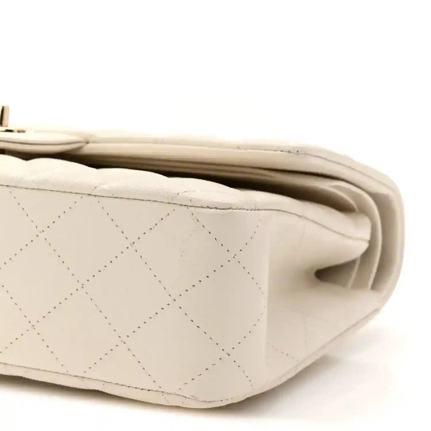 White quilted caviar leather bag side with seam detailing and rolled edge