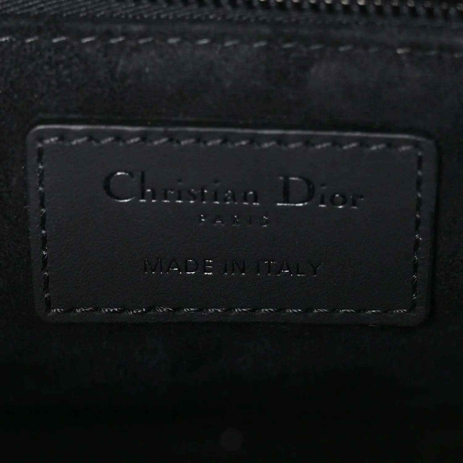 Christian Dior leather handbag label reading “MADE IN ITALY”