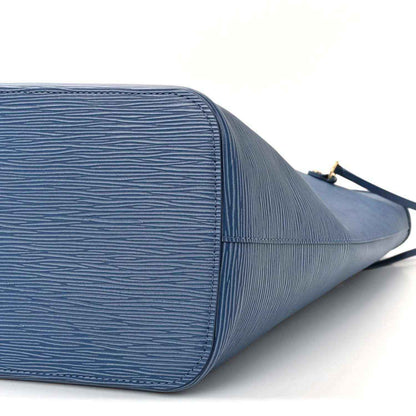 Denim blue leather tote bag close-up of side panel and stitched edges