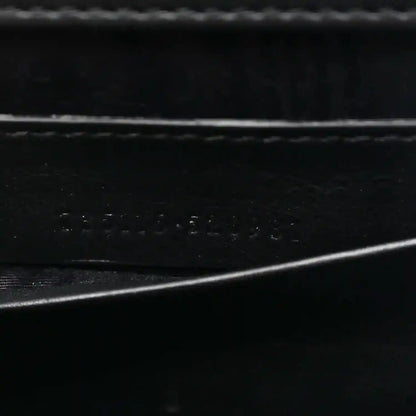 Close-up of black interior lining texture with subtle embossed details