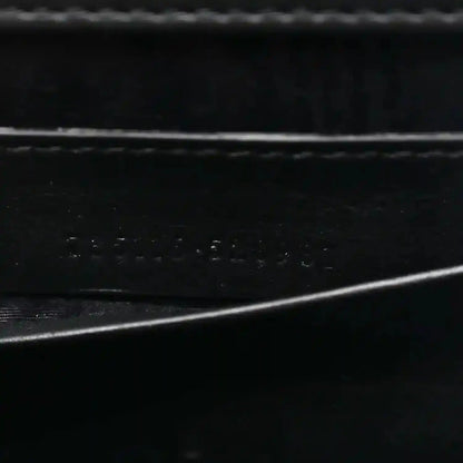 Close-up of black interior lining texture with subtle embossed details