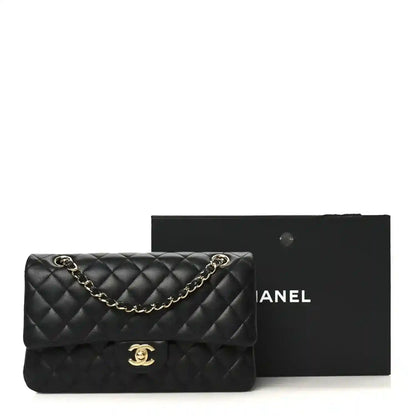 Black quilted lambskin double flap shoulder bag with gold-tone chain and CC clasp