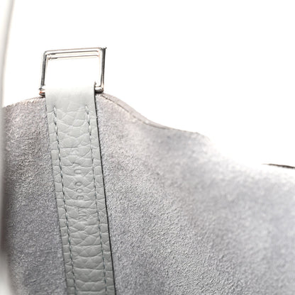 Light blue pebbled leather handle strap with metal buckle detail