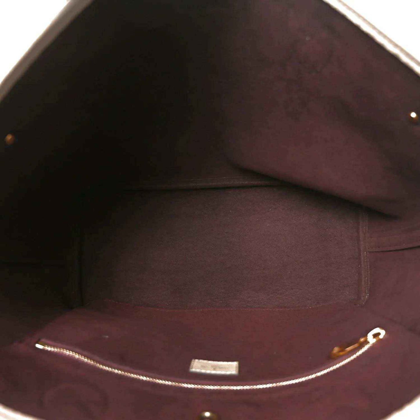 Louis Vuitton Neverfull MM tote bag interior with burgundy lining and zip top