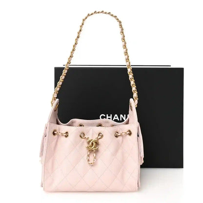 Light pink Chanel mini quilted leather handbag with shoulder chain and tassel pull