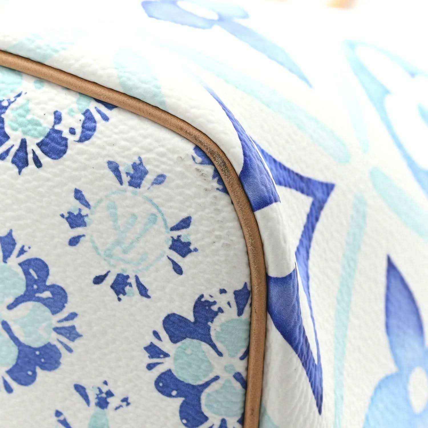 Blue and white monogram tote bag edge with tan leather trim and stitched seam