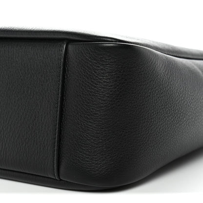 Black calfskin hobo bag corner with visible panel stitching and smooth surface.