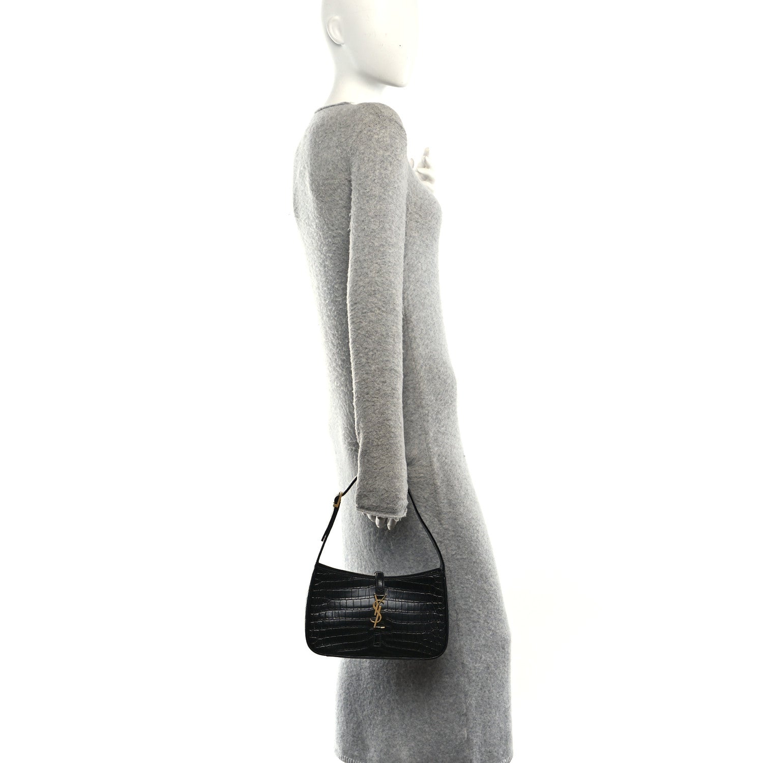 Black embossed calfskin hobo bag on a mannequin with short shoulder handle