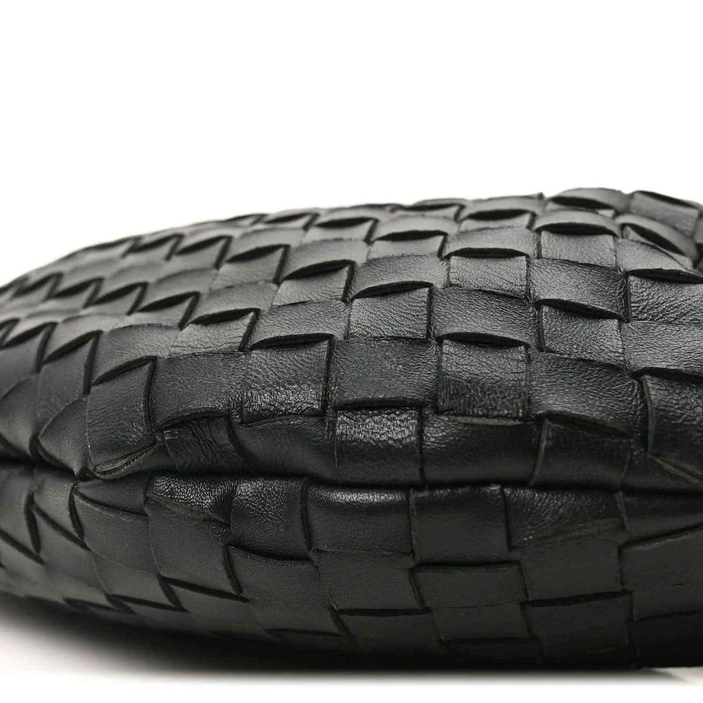Bottega Veneta intrecciato nappa bag bottom in black with woven texture close-up.