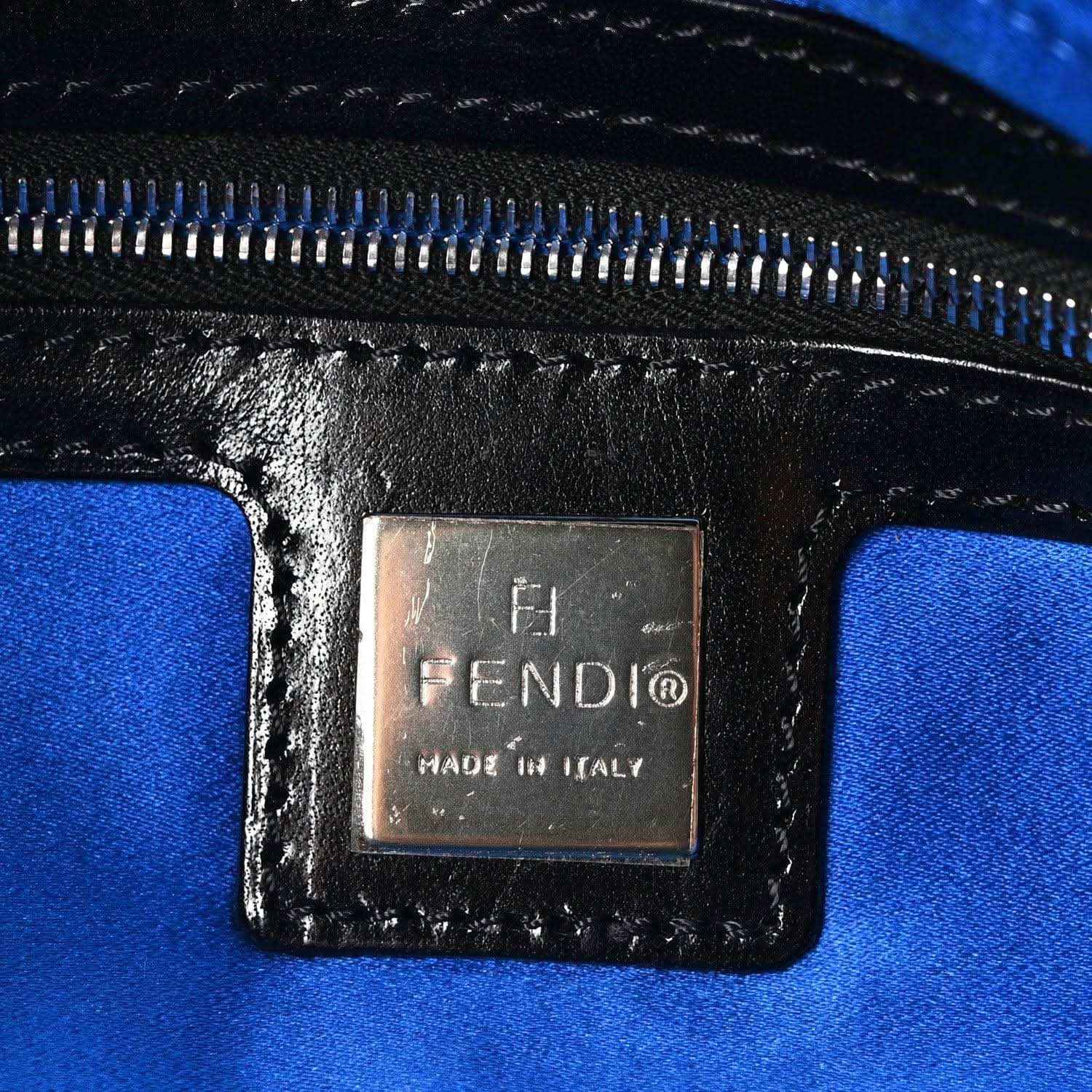 Blue fabric-lined interior with zipper and FENDI logo leather patch