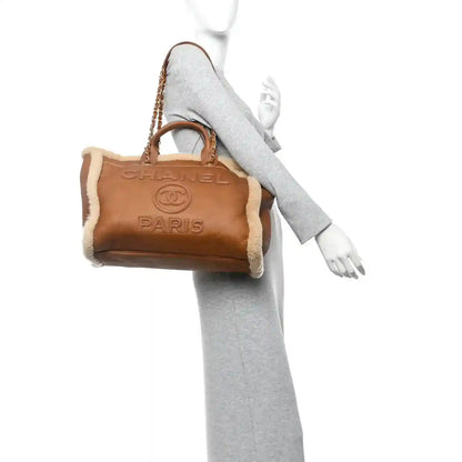 Chanel Deauville tote bag with brown lambskin body and shearling handle trim