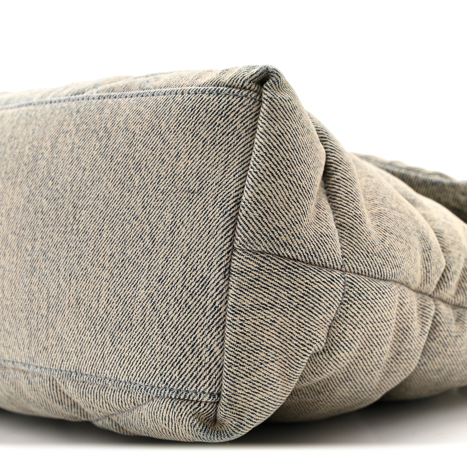 Quilted denim puffer satchel corner with top-stitching