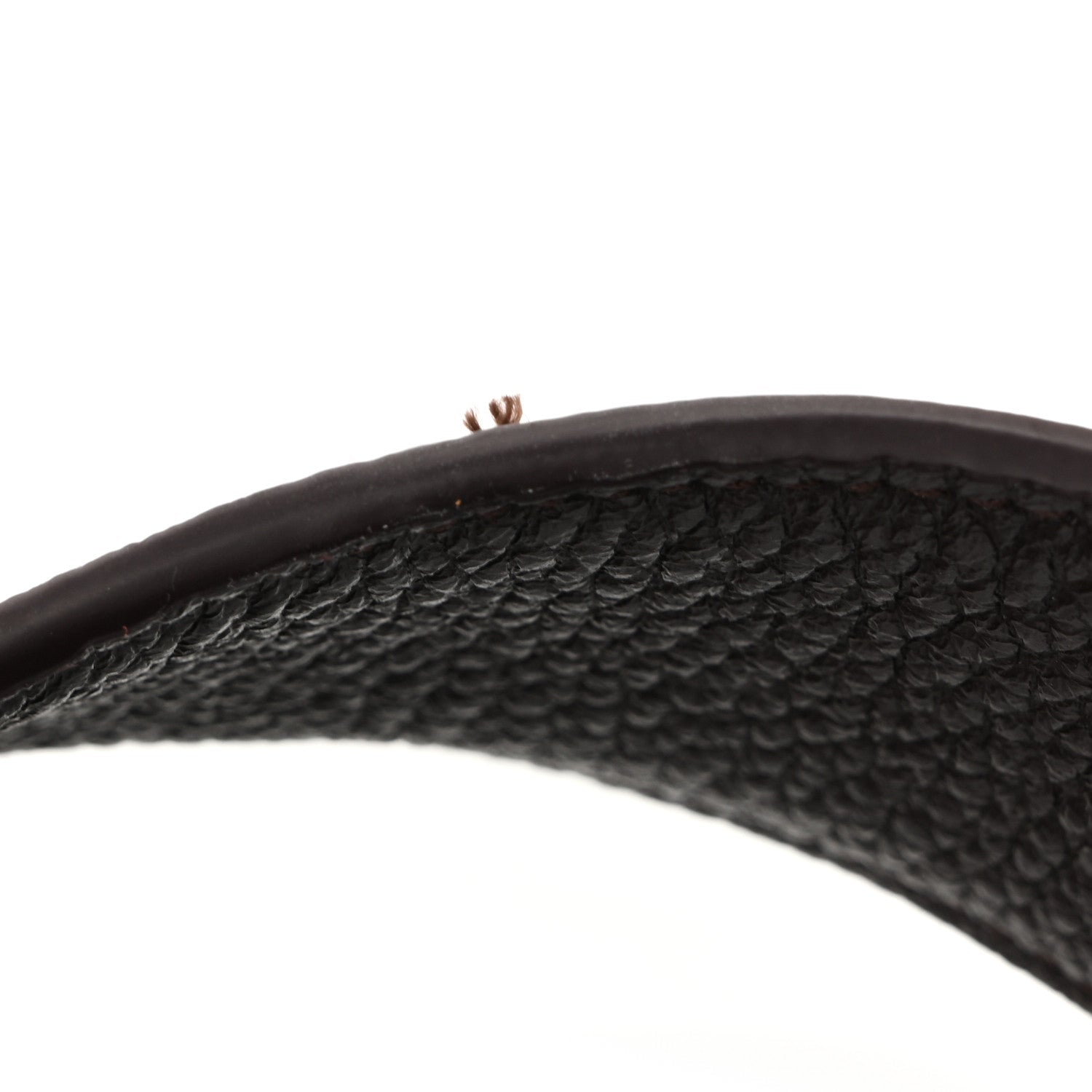 Grained deerskin tote handle in dark brown, pebbled texture and visible stitching