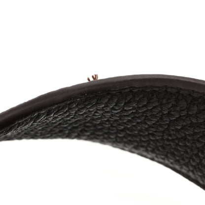 Grained deerskin tote handle in dark brown, pebbled texture and visible stitching
