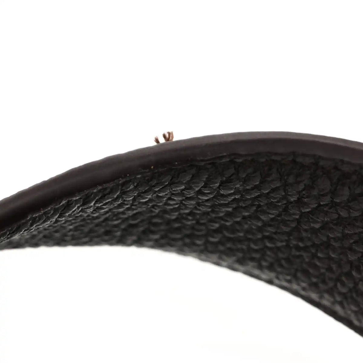 Grained deerskin tote handle in dark brown, pebbled texture and visible stitching