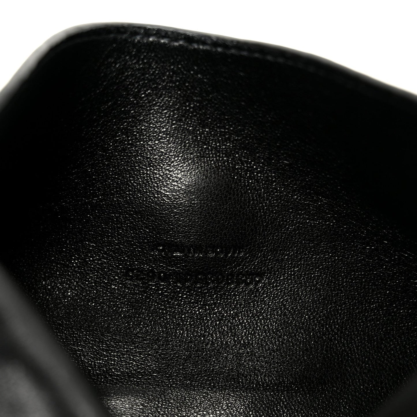 Black quilted leather shoulder bag, close-up of lambskin texture