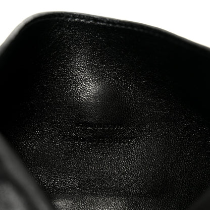 Black quilted leather shoulder bag, close-up of lambskin texture