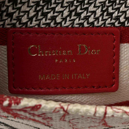 Christian Dior label on handbag lining, red leather patch reading “MADE IN ITALY”