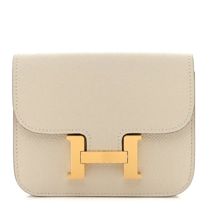 Slim wallet with flap and gold H clasp, light cream textured leather