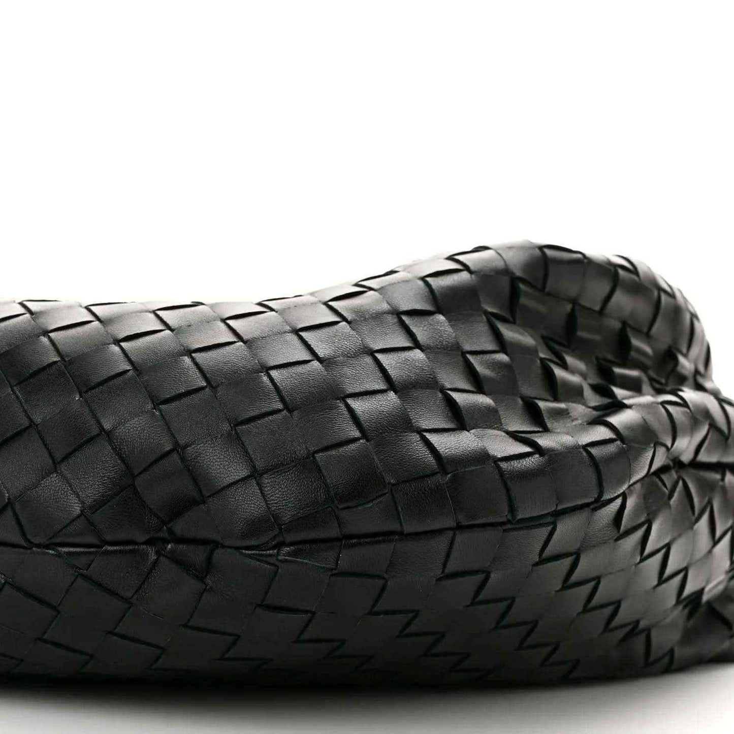 Black woven leather shoulder bag close-up with intrecciato texture