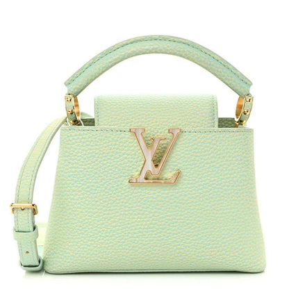 Mini Capucines handbag in light green textured leather with LV front clasp