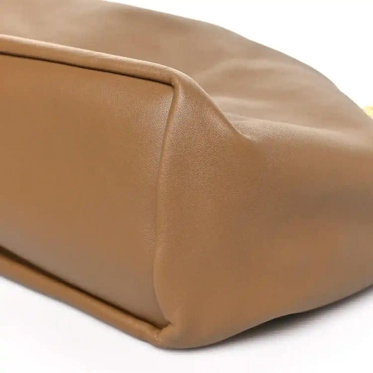 Leather bag side seam and corner stitching detail, oak brown