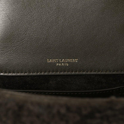 Leather interior panel with 'SAINT LAURENT PARIS' stamp on dark lining