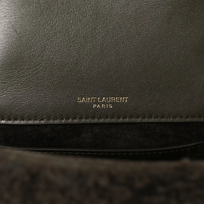 Leather interior panel with 'SAINT LAURENT PARIS' stamp on dark lining