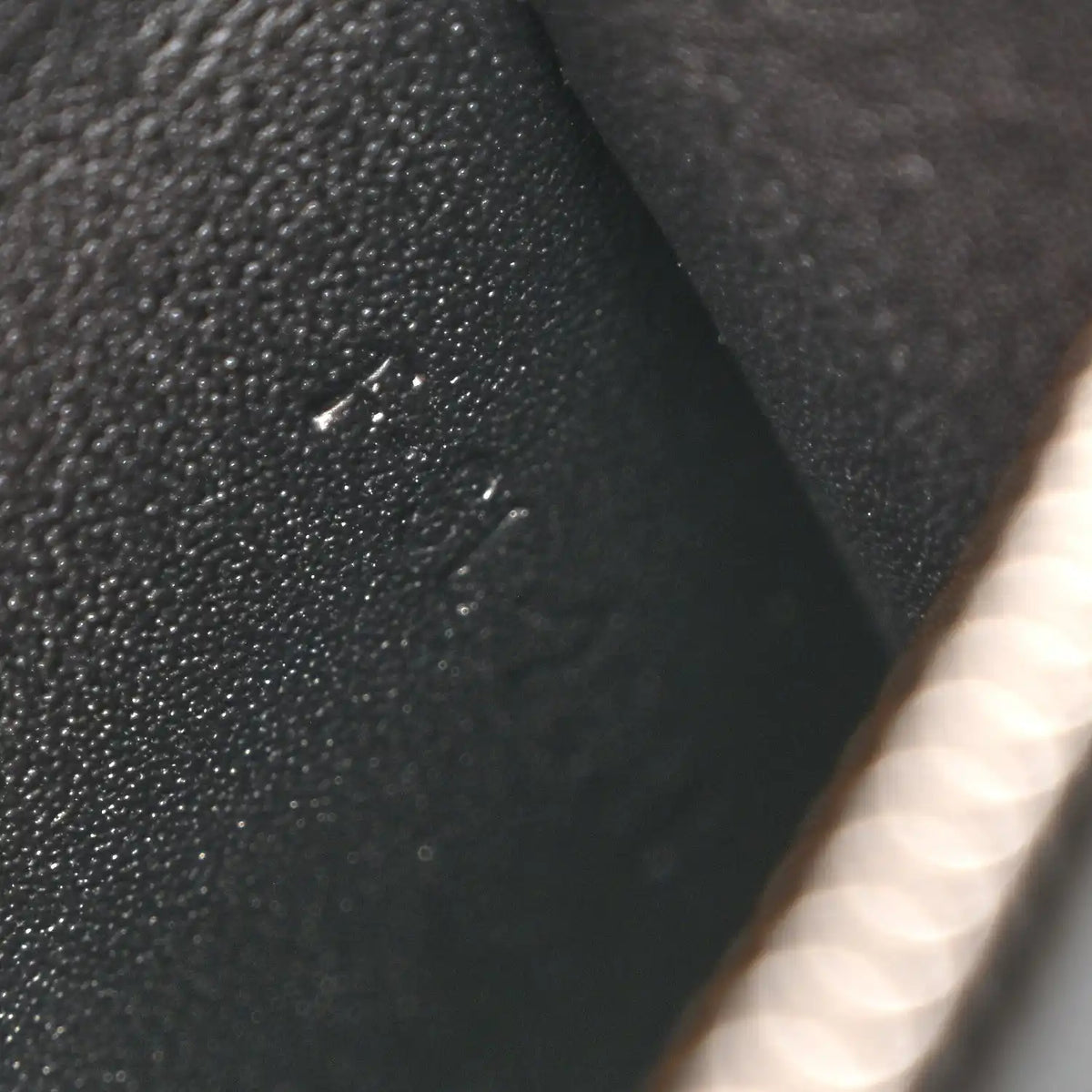 Black leather bag with small visible surface marks on the exterior