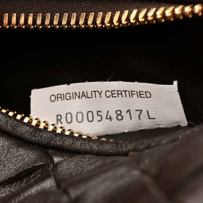 Interior label close-up reading "ORIGINALITY CERTIFIED" with code