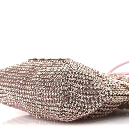 Chanel Mini 22 handbag close-up of pink metallic crystal mesh on rounded front side.