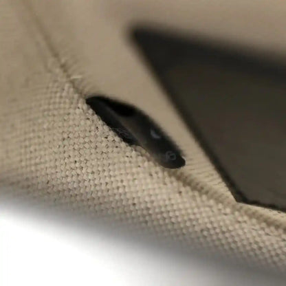 Close-up of black leather corner and stitching detail on mini bag
