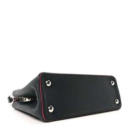 Louis Vuitton Capucines PM leather bag, dark blue body with fuchsia-edged panel and silver studs