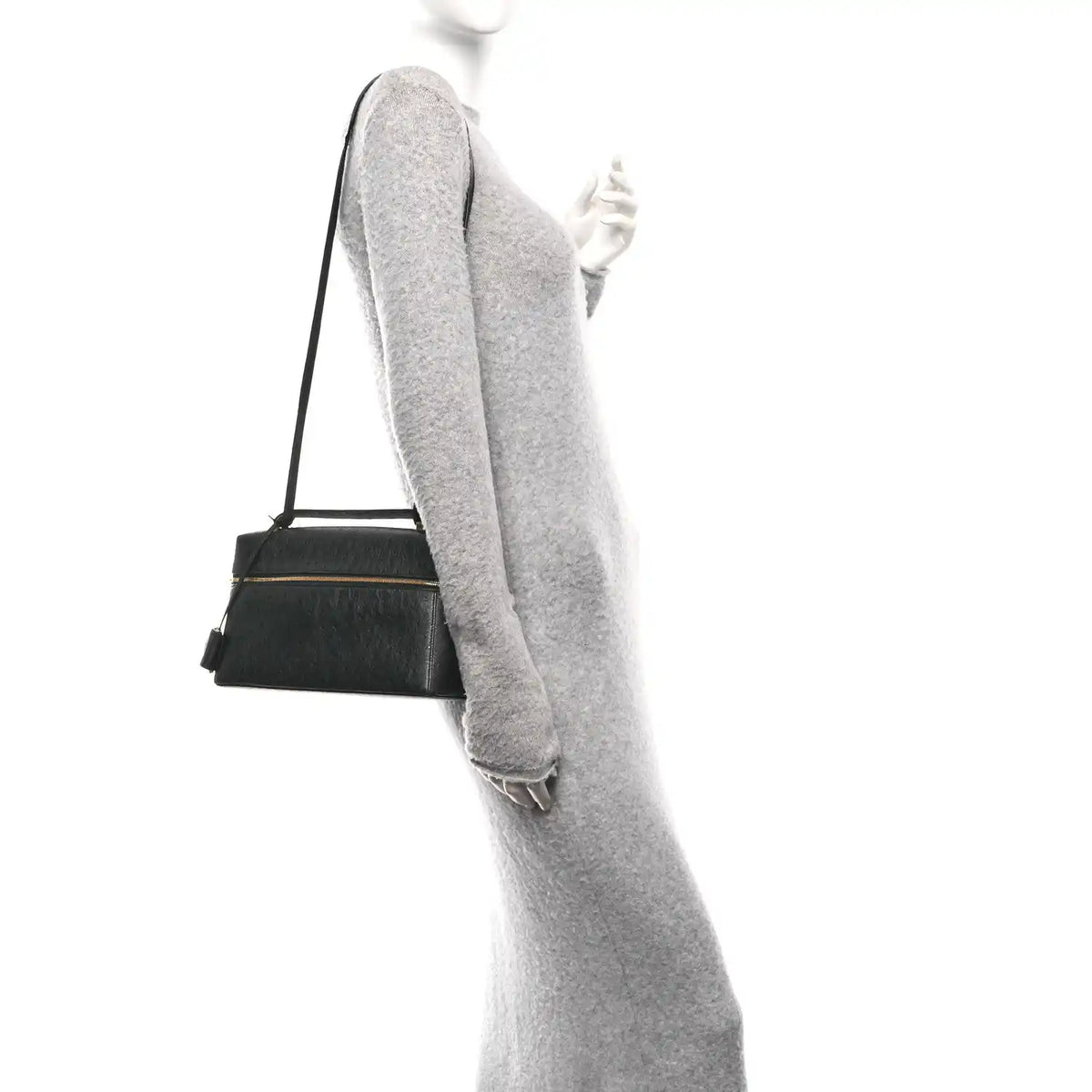 Black ostrich leather crossbody bag with adjustable shoulder strap and top handle.