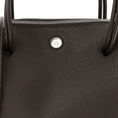 Top view of Loewe Madrid bag in dark grained leather with zipper and logo seal