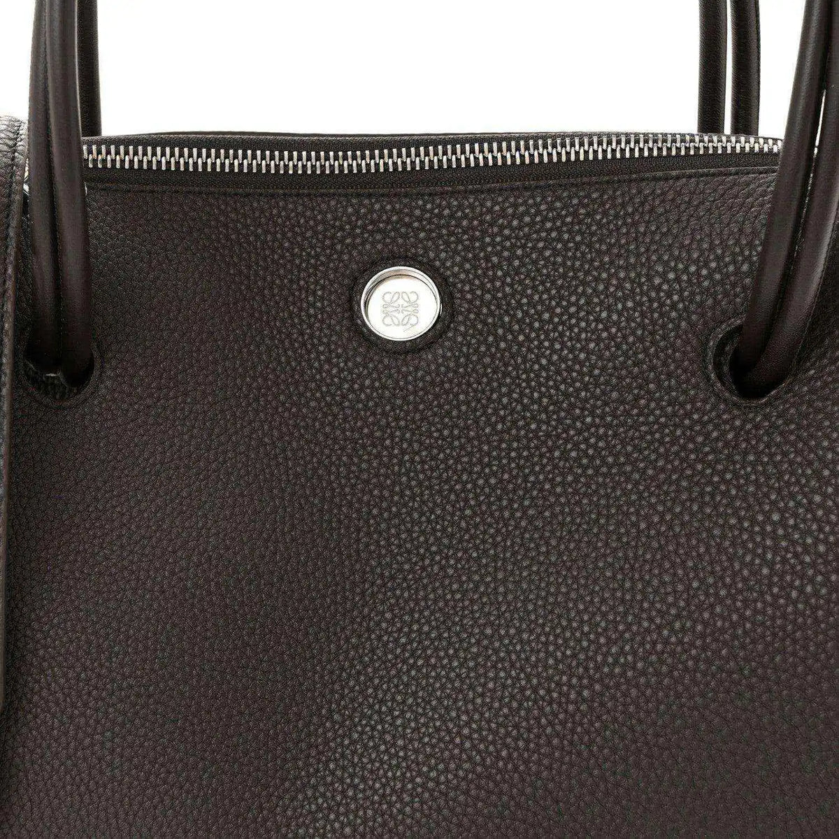 Top view of Loewe Madrid bag in dark grained leather with zipper and logo seal